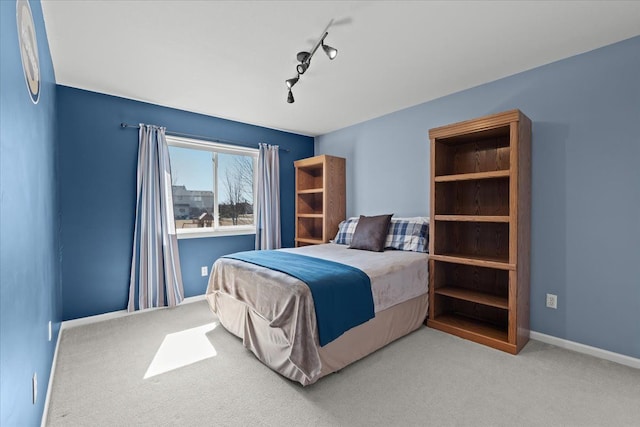9009 N Pheasant Ridge Ln, Saline, MI 48176 - bedroom with carpet flooring, track lighting, and baseboards