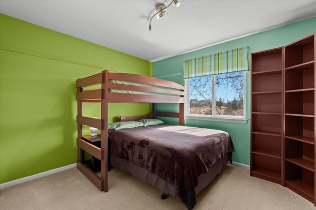 9009 N Pheasant Ridge Ln, Saline, MI 48176 - carpeted bedroom with baseboards and rail lighting