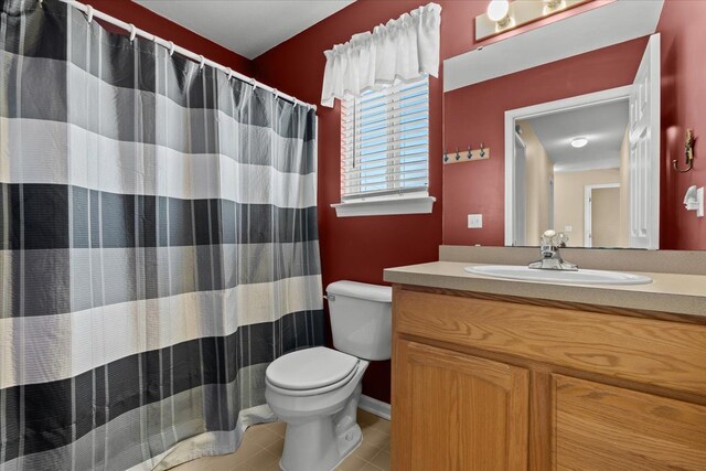 9009 N Pheasant Ridge Ln, Saline, MI 48176 - full bathroom featuring toilet, vanity, and tile patterned flooring