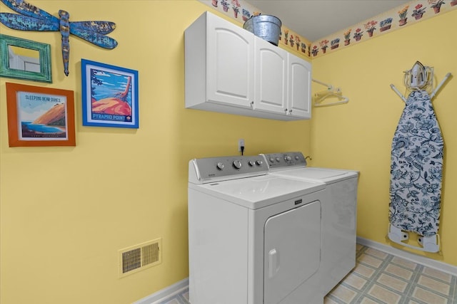 9009 N Pheasant Ridge Ln, Saline, MI 48176 - washroom featuring cabinet space, separate washer and dryer, baseboards, and light floors