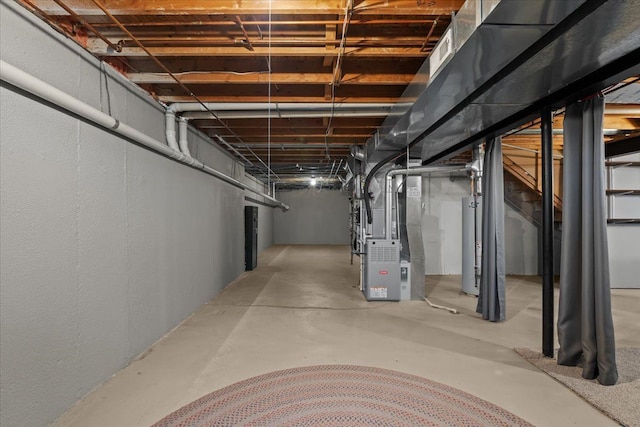 9009 N Pheasant Ridge Ln, Saline, MI 48176 - unfinished basement featuring heating unit and gas water heater
