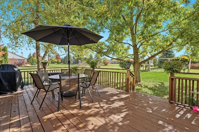 9009 N Pheasant Ridge Ln, Saline, MI 48176 - wooden terrace with a lawn, a grill, and outdoor dining space