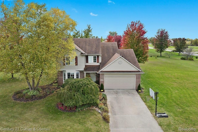 9009 N Pheasant Ridge Ln, Saline, MI 48176 - view of front of home with an attached garage, brick siding, a front lawn, and concrete driveway