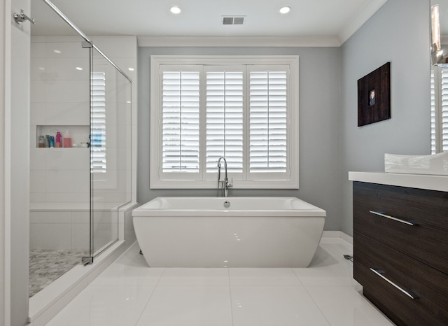 628 Watkins St, Birmingham, MI 48009 - full bathroom with a stall shower, a freestanding bath, tile patterned flooring, vanity, and crown molding