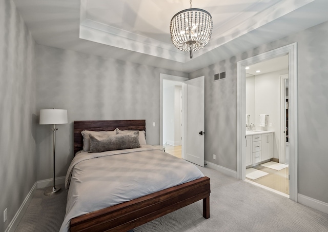 628 Watkins St, Birmingham, MI 48009 - bedroom with a chandelier, baseboards, light colored carpet, and a sink