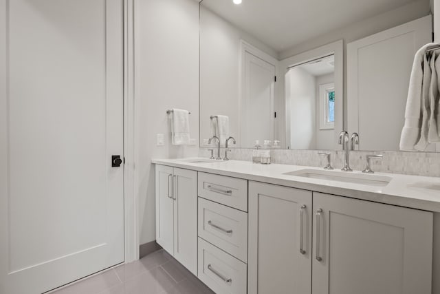 628 Watkins St, Birmingham, MI 48009 - bathroom featuring tile patterned floors, double vanity, and recessed lighting