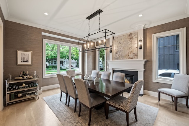 628 Watkins St, Birmingham, MI 48009 - dining area with baseboards, a glass covered fireplace, light wood-style flooring, recessed lighting, and a chandelier
