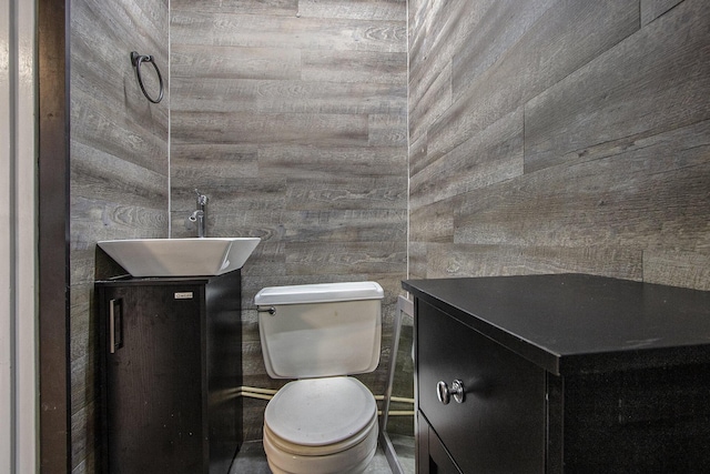 23431 Shurte St, Cassopolis, MI 49031 - half bath featuring vanity, toilet, and wood walls