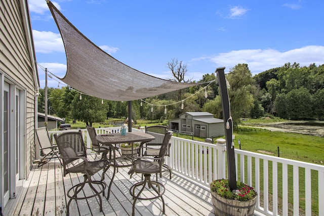 23431 Shurte St, Cassopolis, MI 49031 - wooden deck with a yard, outdoor dining area, and an outbuilding