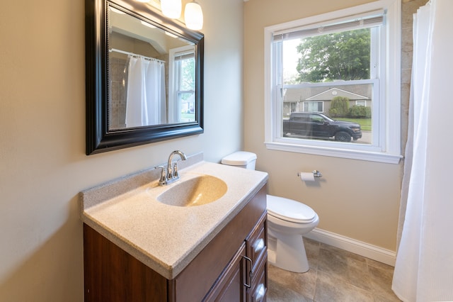 14560 Arden St, Livonia, MI 48154 - bathroom featuring plenty of natural light, baseboards, vanity, and toilet