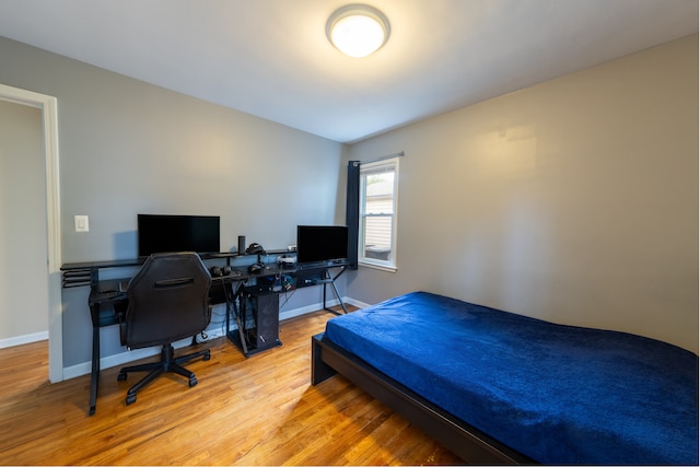 14560 Arden St, Livonia, MI 48154 - bedroom featuring wood finished floors, baseboards, and a desk