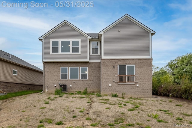 24180 Liberty Hill Dr, Farmington, MI 48336 - rear view of property with brick siding and central air condition unit