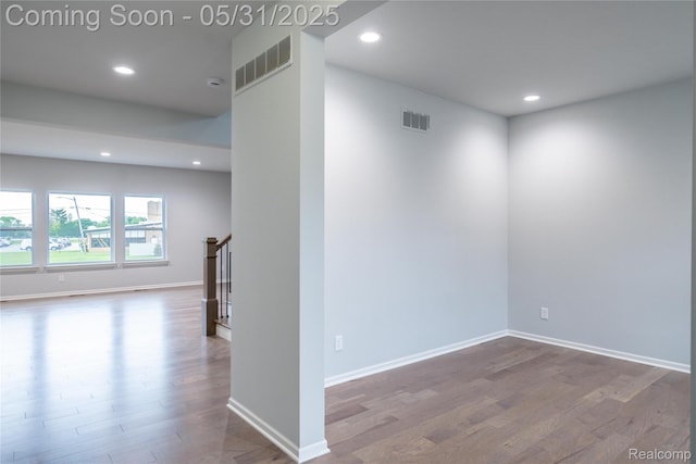 24180 Liberty Hill Dr, Farmington, MI 48336 - spare room with wood finished floors, recessed lighting, stairway, and baseboards