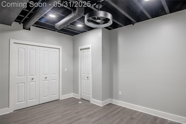 24180 Liberty Hill Dr, Farmington, MI 48336 - unfurnished bedroom with wood finished floors, baseboards, and a closet