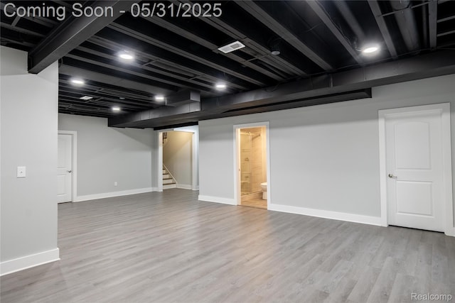 24180 Liberty Hill Dr, Farmington, MI 48336 - finished below grade area featuring wood finished floors, stairs, and baseboards