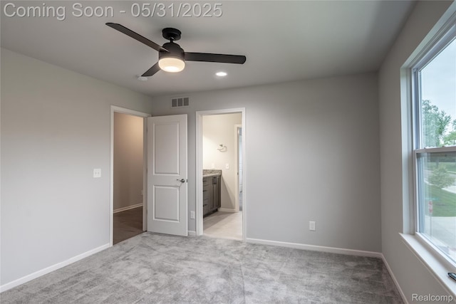 24180 Liberty Hill Dr, Farmington, MI 48336 - unfurnished bedroom featuring light colored carpet, baseboards, ensuite bathroom, ceiling fan, and recessed lighting