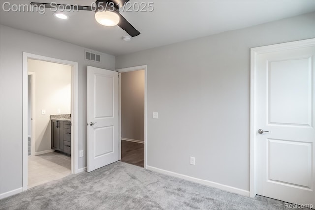 24180 Liberty Hill Dr, Farmington, MI 48336 - unfurnished bedroom with light colored carpet, ensuite bath, baseboards, and a ceiling fan