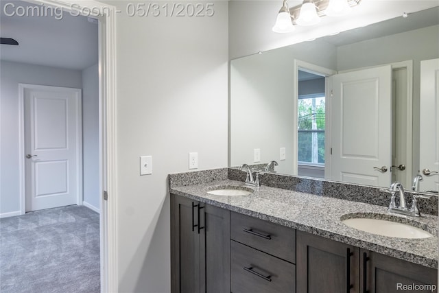 24180 Liberty Hill Dr, Farmington, MI 48336 - bathroom featuring double vanity and baseboards