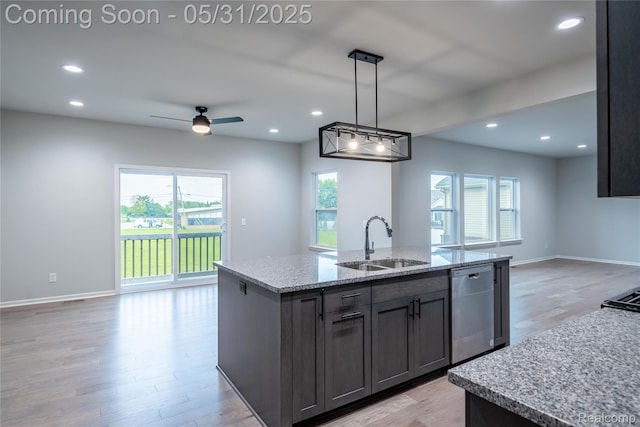 24180 Liberty Hill Dr, Farmington, MI 48336 - kitchen with a sink, stainless steel dishwasher, open floor plan, light wood finished floors, and an island with sink