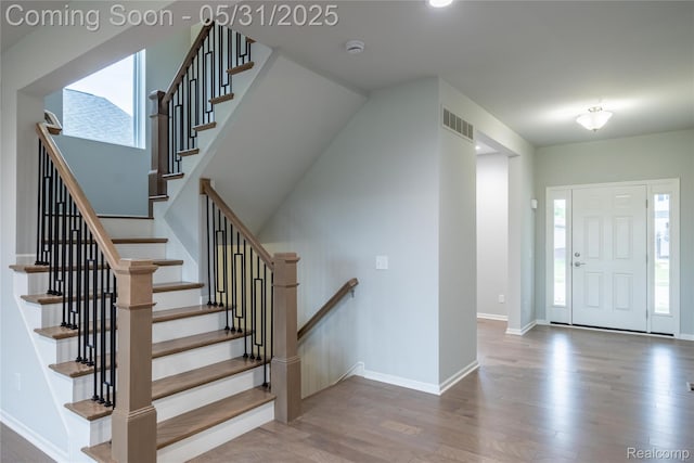 24180 Liberty Hill Dr, Farmington, MI 48336 - foyer entrance featuring wood finished floors, baseboards, stairs, and recessed lighting