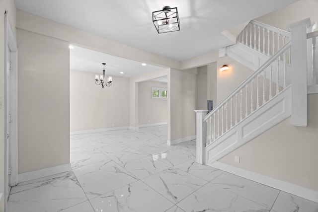 foyer entrance featuring baseboards, a chandelier, marble finish flooring, stairway, and recessed lighting