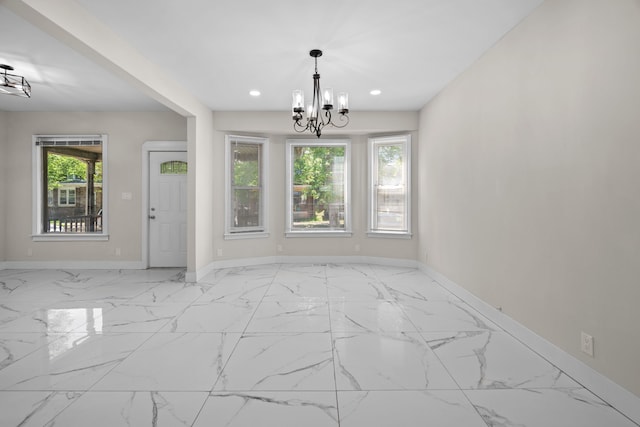 unfurnished dining area featuring baseboards, a chandelier, recessed lighting, and marble look tiles