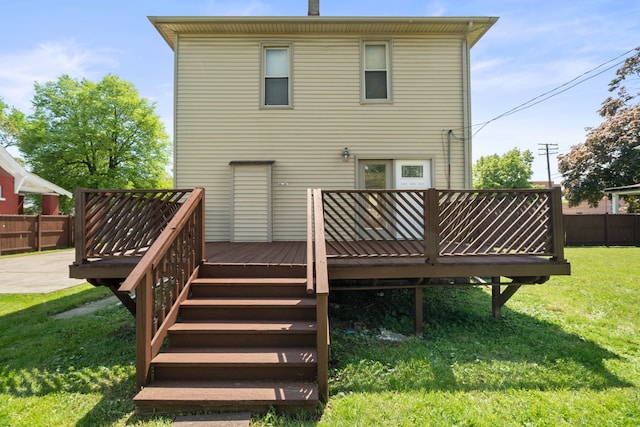 rear view of property featuring a deck
