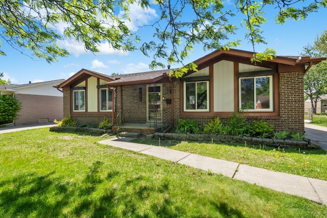 25679 Cloie Dr, Warren, MI 48089 - view of front of house featuring brick siding and a front lawn