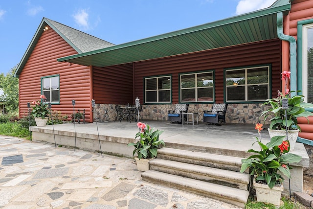 4435 Imlay City Rd, Attica, MI 48412 - back of property featuring log veneer siding, stone siding, a porch, and roof with shingles