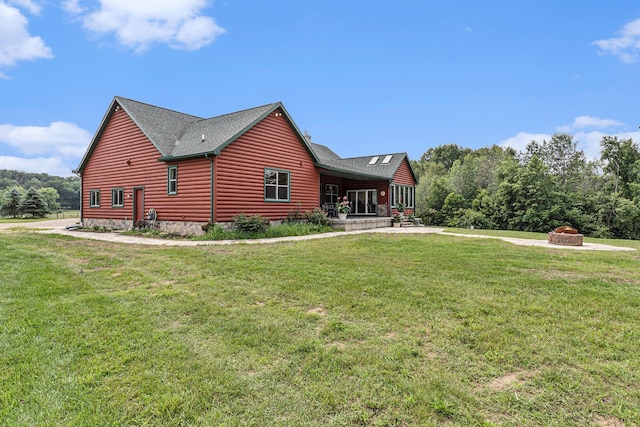 4435 Imlay City Rd, Attica, MI 48412 - view of home's exterior with a lawn, faux log siding, a porch, and a shingled roof