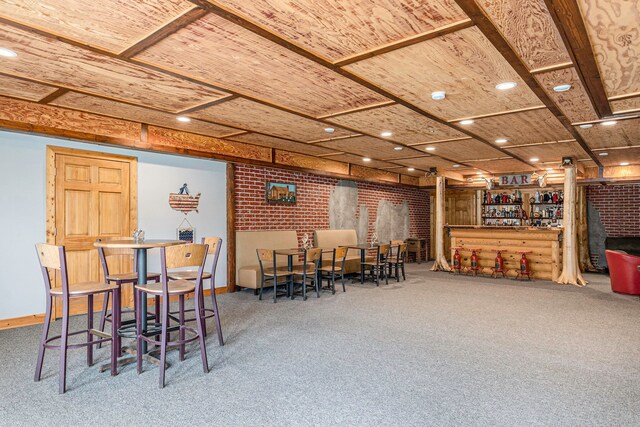 4435 Imlay City Rd, Attica, MI 48412 - carpeted dining area with a dry bar, baseboards, and brick wall