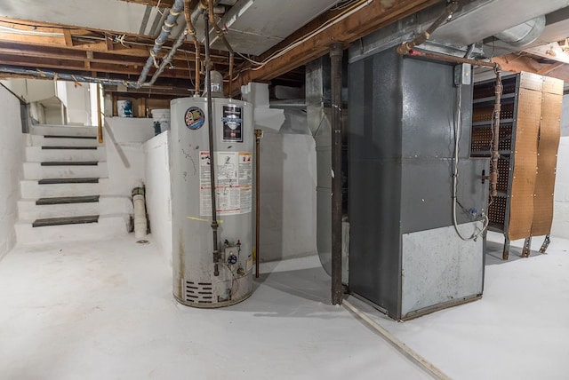 unfinished below grade area featuring gas water heater, heating unit, and stairs