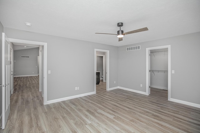 2421 Darah St, Niles, MI 49120 - unfurnished bedroom with baseboards, light wood-style flooring, and a spacious closet