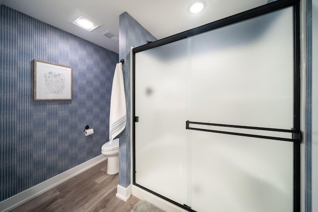 3280 Amtrak Dr SW, Byron Center, MI 49315 - bathroom with wood finished floors, toilet, baseboards, and a stall shower