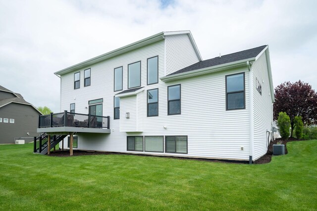 3280 Amtrak Dr SW, Byron Center, MI 49315 - rear view of house featuring stairway, a deck, a yard, and cooling unit