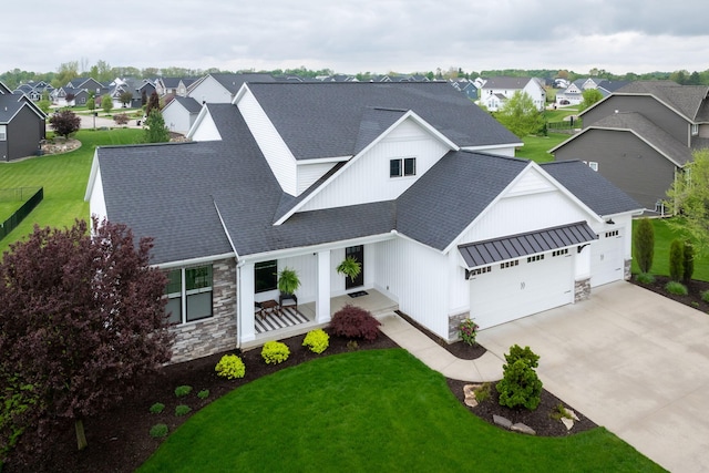 3280 Amtrak Dr SW, Byron Center, MI 49315 - modern inspired farmhouse featuring stone siding, a shingled roof, a garage, and a residential view