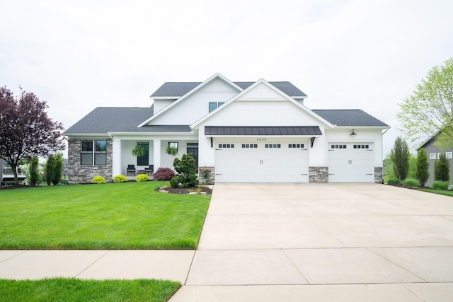 3280 Amtrak Dr SW, Byron Center, MI 49315 - modern farmhouse featuring stone siding, an attached garage, concrete driveway, and a front lawn
