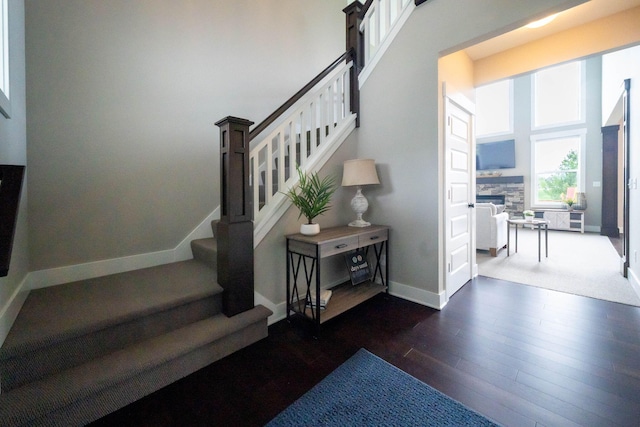 3280 Amtrak Dr SW, Byron Center, MI 49315 - stairs with wood finished floors, baseboards, and a fireplace