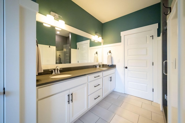 3280 Amtrak Dr SW, Byron Center, MI 49315 - bathroom with a shower stall, tile patterned flooring, and double vanity