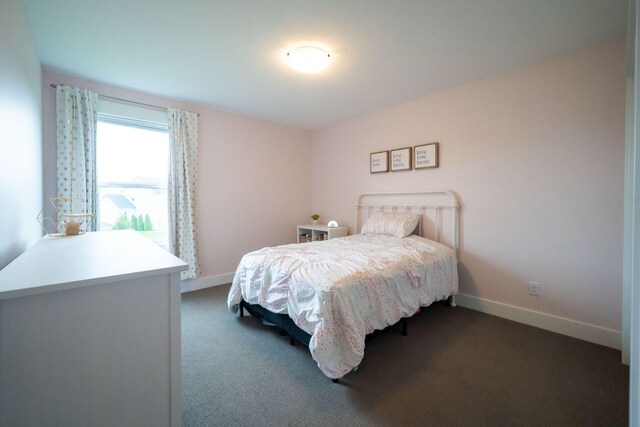 3280 Amtrak Dr SW, Byron Center, MI 49315 - bedroom with baseboards and dark carpet