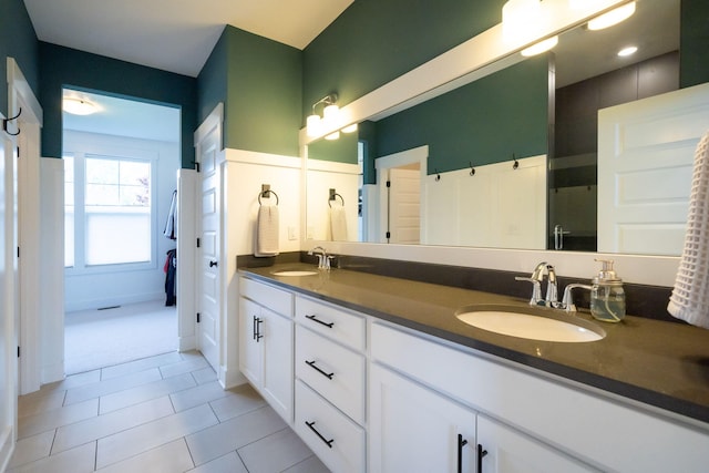 3280 Amtrak Dr SW, Byron Center, MI 49315 - bathroom featuring double vanity and tile patterned flooring