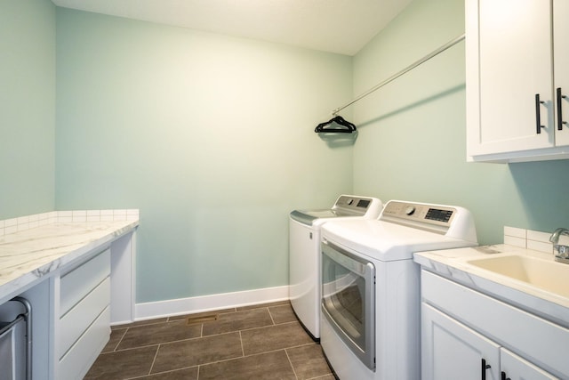 3280 Amtrak Dr SW, Byron Center, MI 49315 - laundry area with washer and clothes dryer, cabinet space, and baseboards
