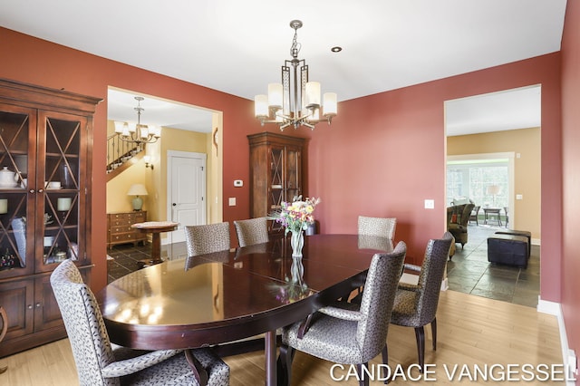 2429 Shears Crossing Ct NE, Grand Rapids, MI 49525 - dining area with a chandelier and light wood-style floors