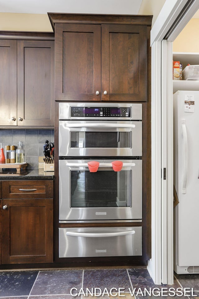2429 Shears Crossing Ct NE, Grand Rapids, MI 49525 - kitchen with a warming drawer, freestanding refrigerator, double oven, and dark brown cabinets