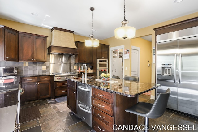 2429 Shears Crossing Ct NE, Grand Rapids, MI 49525 - kitchen featuring stainless steel appliances, custom exhaust hood, backsplash, and a sink