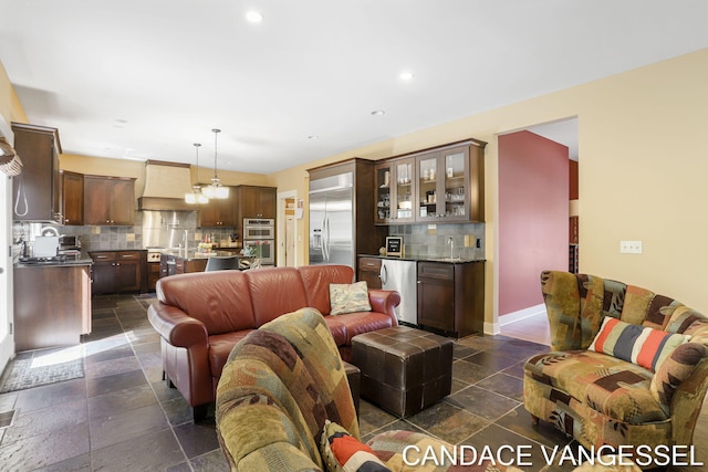2429 Shears Crossing Ct NE, Grand Rapids, MI 49525 - living area with recessed lighting, baseboards, stone tile floors, and bar