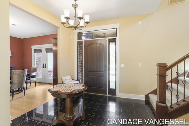 2429 Shears Crossing Ct NE, Grand Rapids, MI 49525 - entryway with granite tiled floors, a chandelier, baseboards, and stairway
