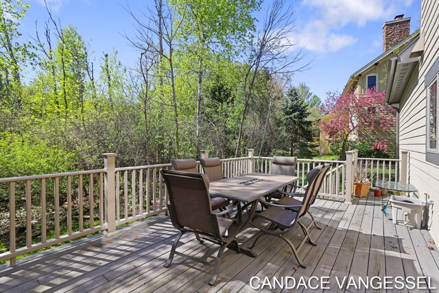 2429 Shears Crossing Ct NE, Grand Rapids, MI 49525 - wooden deck featuring outdoor dining space