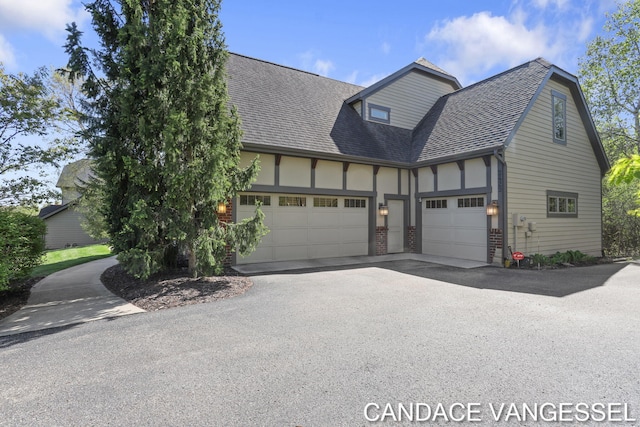 2429 Shears Crossing Ct NE, Grand Rapids, MI 49525 - view of front of property with a garage, driveway, roof with shingles, and brick siding