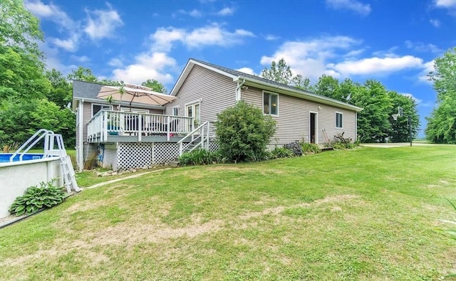 5856 Peck Rd, Brown City, MI 48416 - rear view of property with a wooden deck and a lawn